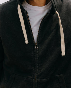 fit model showing off the zipper on The Apres Zip Hoodie in Black Indigo Terry, Knits by Taylor Stitch