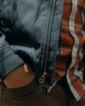 fit model showing off the zipper on The Insulated Bomber Jacket in Dark Navy Dry Wax, Outerwear by Taylor Stitch