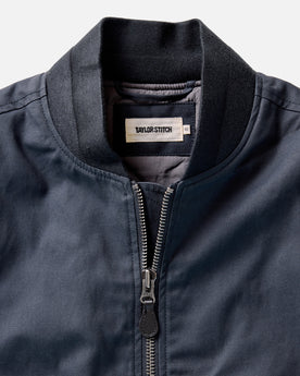 material shot of the collar on The Insulated Bomber Jacket in Dark Navy Dry Wax, Outerwear by Taylor Stitch
