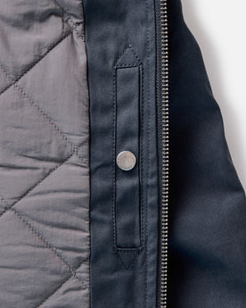 material shot of the inside pocket on The Insulated Bomber Jacket in Dark Navy Dry Wax, Outerwear by Taylor Stitch