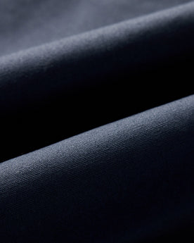 material shot of the fabric on The Insulated Bomber Jacket in Dark Navy Dry Wax, Outerwear by Taylor Stitch