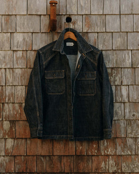 editorial image of The Shop Shirt in Rinsed Indigo Selvedge hanging, Wovens by Taylor Stitch