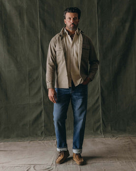 fit model posing in The Straight Jean in Mid Wash Organic Selvedge, Bottoms by Taylor Stitch