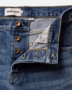 material shot of the buttons on The Straight Jean in Mid Wash Organic Selvedge, Bottoms by Taylor Stitch