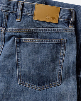 material shot of the back pocket on The Straight Jean in Mid Wash Organic Selvedge, Bottoms by Taylor Stitch