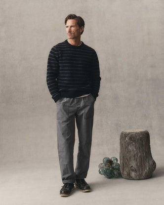 fit model with his hands in the pockets of The Breakwater Pant in Dark Grey Ripstop