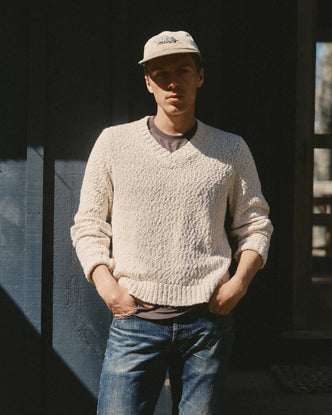 fit model posing in The Match V-Neck Sweater in Vintage White Slub