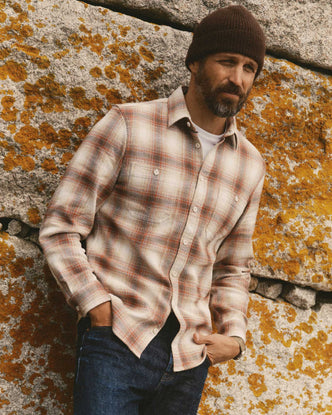 fit model leaning against the wall wearing The Utility Shirt in Seaside Check Sashiko