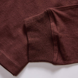 material shot of the ribbed cuff on The Cotton Hemp Long Sleeve Tee in Burgundy
