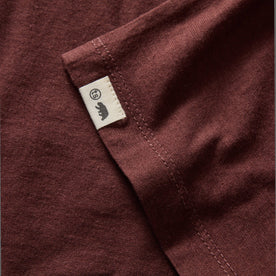 material shot of the hem and TS label on The Cotton Hemp Long Sleeve Tee in Burgundy