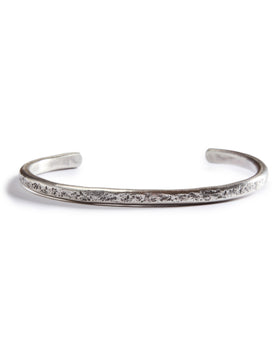 flatlay of The Hammered Cuff in Silver, Accessories by Taylor Stitch
