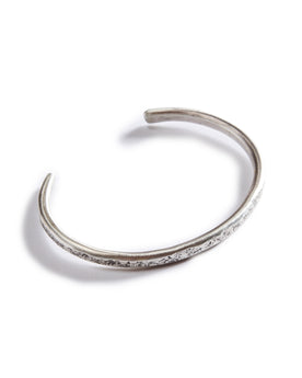 flatlay of The Hammered Cuff in Silver, from the top, Accessories by Taylor Stitch