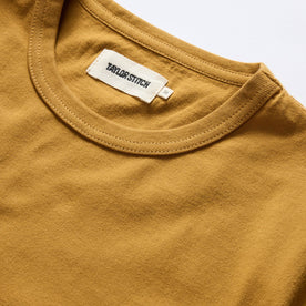 material shot of the collar on The Organic Cotton Tee in Old Gold