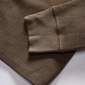 material shot of the ribbed cuffs on The Organic Cotton Waffle Crew in Fatigue Olive