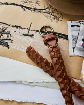 editorial image of The Braided Belt in Whiskey on a drawing, Accessories by Taylor Stitch