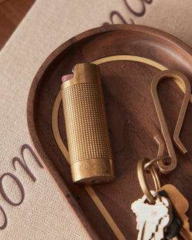 Our brass lighter sleeve and keyhook on The Valet Tray in Walnut and Brass, Accessories by Taylor Stitch