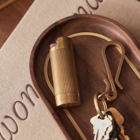 Our brass lighter sleeve and keyhook on The Valet Tray in Walnut and Brass