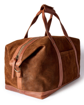 flatlay of The Weekender Duffle in Chocolate Roughout, from an angle, Accessories by Taylor Stitch