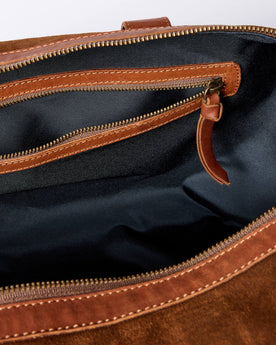 material shot of the zipper pocket on The Weekender Duffle in Chocolate Roughout, Accessories by Taylor Stitch