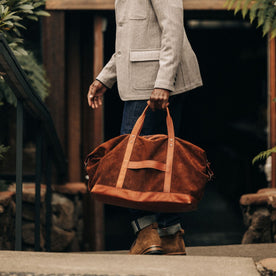 fit model with The Weekender Duffle in Chocolate Roughout