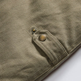 material shot of the side snaps on The Workhorse Vest in Stone Boss Duck