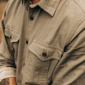 fit model showing the front flap chest pockets on The Saddler Shirt in Smoked Olive Twill