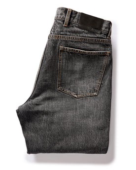 flatlay of The Democratic Jean in Black 1-Year Wash Selvage Denim, folded from back, Bottoms by Taylor Stitch