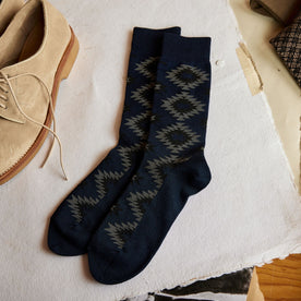 The Crew Sock in Navy Kilim on table