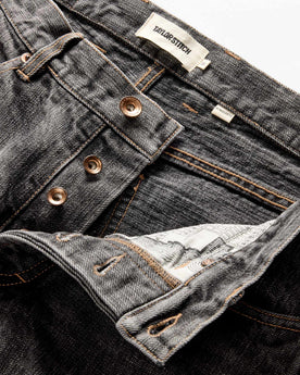 material shot of the button fly on The Democratic Jean in Black 1-Year Wash Selvage Denim, Bottoms by Taylor Stitch