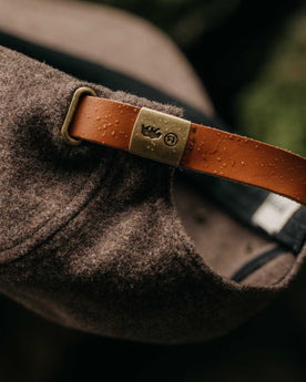 editorial image of water on the cap band of The 5-Panel Cap in Heather Sable Wool Blend, Accessories by Taylor Stitch