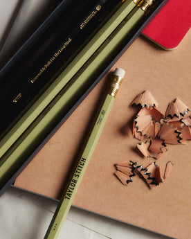 editorial image of The Cedar Hex Pencil (12-Pack) next to pencil shavings, Accessories by Taylor Stitch