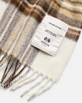 material shot of the label on The Fireside Scarf in Butterscotch Plaid, Accessories by Taylor Stitch