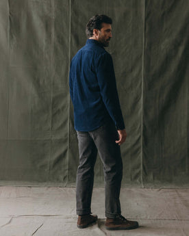 fit model showing off the back of The Jack in Heather Rinsed Indigo Pincord, Wovens by Taylor Stitch