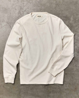 editorial flatlay of The Organic Cotton Long Sleeve Tee in Vintage White, Knits by Taylor Stitch