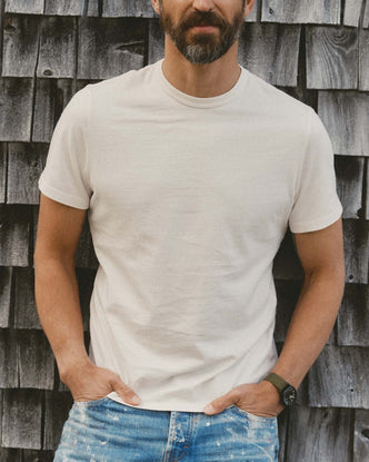 fit model walking wearing The Organic Cotton Tee in Vintage White