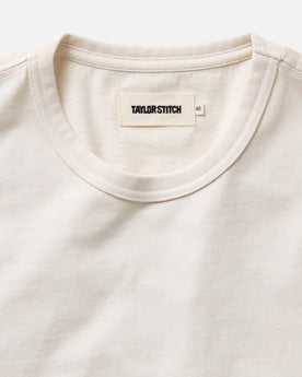 fit model showing off sleeves on The Organic Cotton Tee in Vintage White, Knits by Taylor Stitch