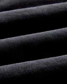 material shot of the fabric on The Shop Shirt in Washed Black Organic Slub Selvedge, Wovens by Taylor Stitch
