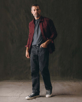 fit model walking wearing The Straight Jean in Washed Black Organic Slub Selvedge, Bottoms by Taylor Stitch