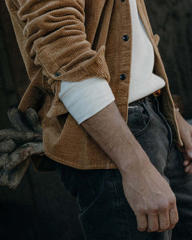 fit model posing in The Utility Shirt in Bourbon Corduroy, Wovens by Taylor Stitch