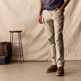 fit model standing in The Camp Pant in Light Khaki Chipped Canvas
