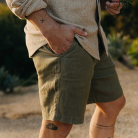 fit model with his hand in the pocket of The Easy Short in Olive Linen