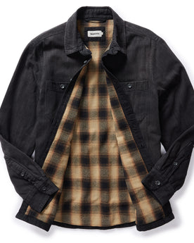 flatlay of The Lined Utility Shirt in Washed Black Denim, shown with plaid lining inside, Wovens by Taylor Stitch