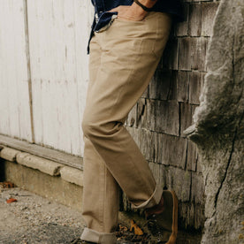 fit model showing the side of The Democratic All Day Pant in Light Khaki Broken Twill