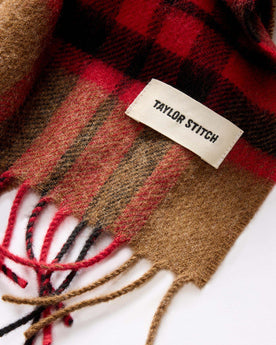material shot of the TS label on The Fireside Scarf in Camel Tartan Merino, Accessories by Taylor Stitch