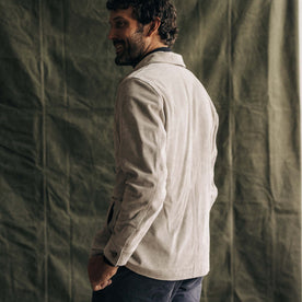fit model showing the back of The Ojai Jacket in Oyster Suede