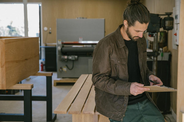 kyle rocking the longshore holding a clipboard while in studio