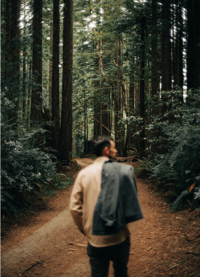 Model walking in the woods
