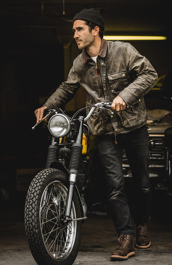 Our creative director wheeling his motorcycle out of his garage.
