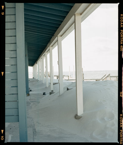 Film image of a sandy porch by the beach