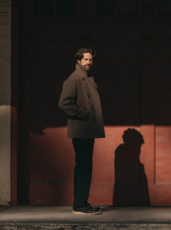 The Mariner Coat hanging on a hook